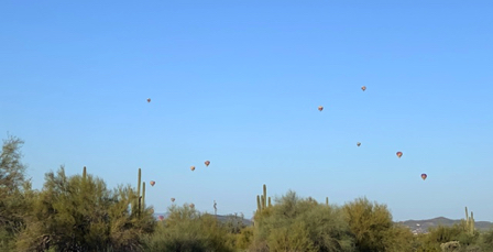 Mar 26 - We counted at least 17 balloons in the sky on Sunday morning while driving west on Carefree Hwy.